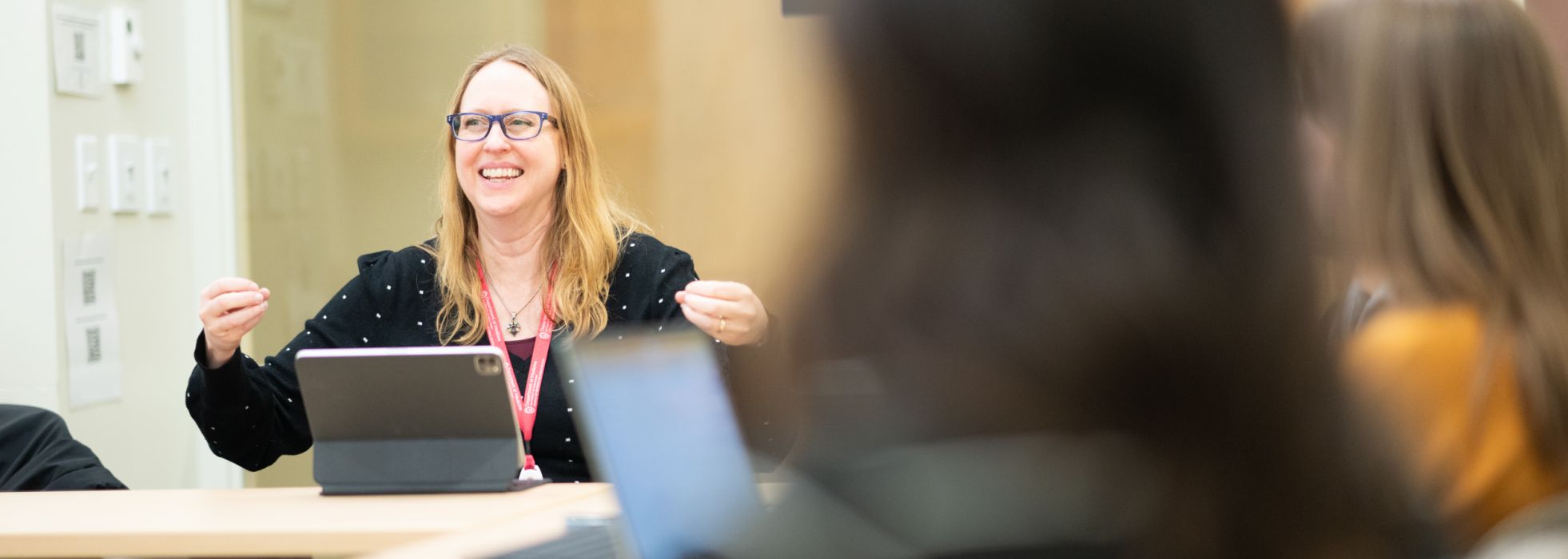 Dr. Amy Zelenski talking to a group enthusiastically