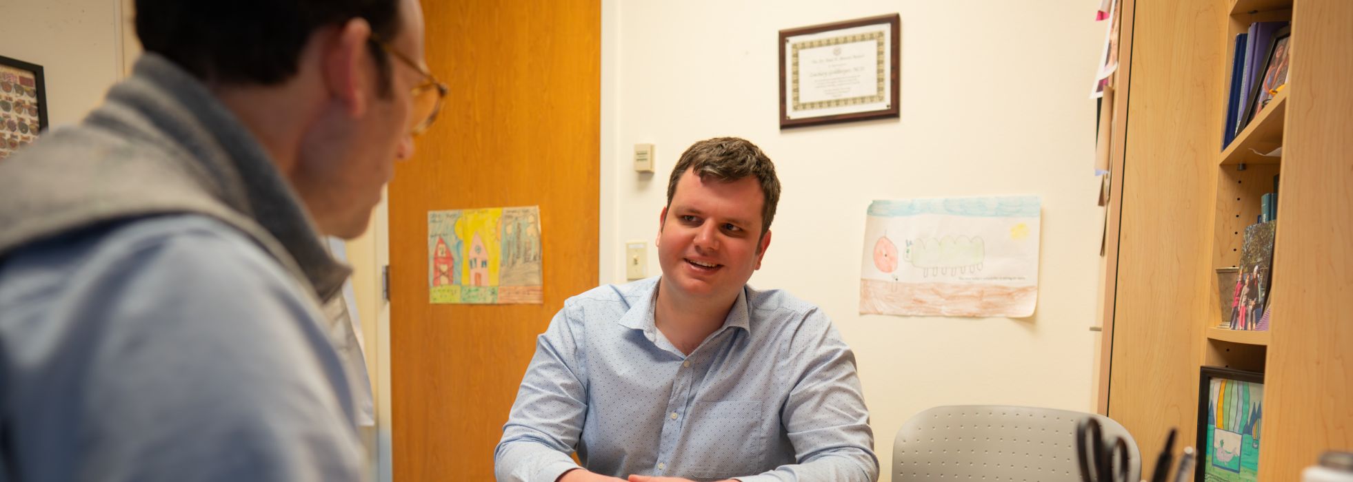 Dr. Zach Goldberger talking to a fellow