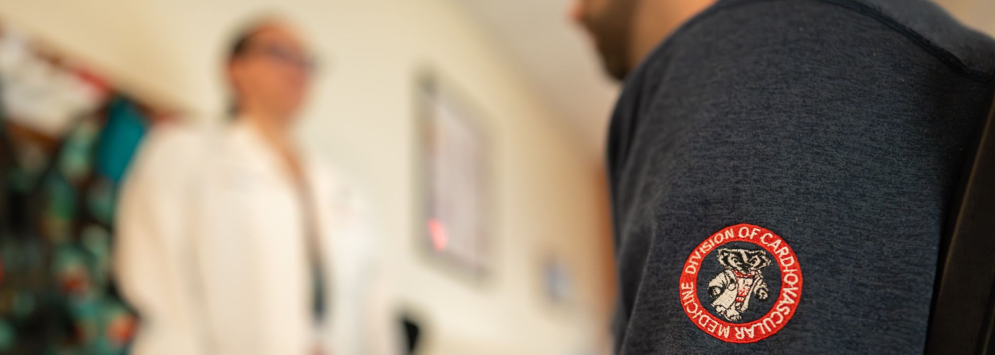 Cardiovascular medicine fellow sits and listens