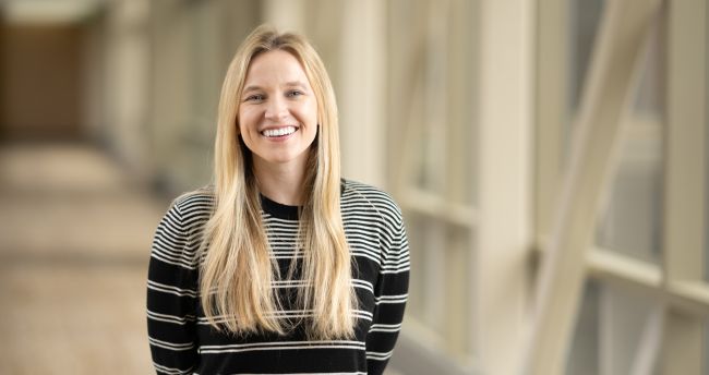 Photo of Dr. Caroline Burkey wearing a striped sweater