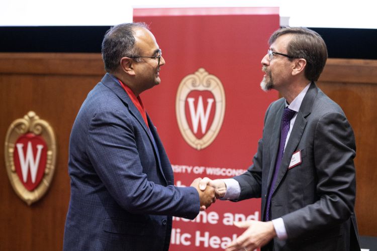 Dr. Raval shaking hands at the SMPH investiture ceremony