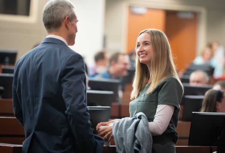 Dr. Ely, on left, chats with internal medicine resident Jessica Giles, MD, PG-3.