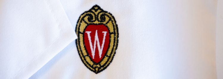 White coat with embroidered UW crest