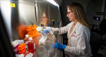 Hilary Faust, MD, MS, in the lab.