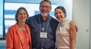 Photo of Dr. Joel Miller, in center, with his General Internal Medicine colleagues Betsy Trowbridge, MD, Kenneth D. Skaar, MD, Chair of Primary Care and division chief, on left, and Lisa Grant, DO, MSW, clinical professor, on right.