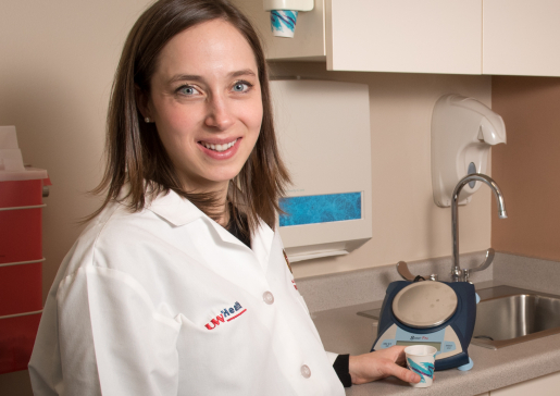 Sara McCoy, MD, PhD, in clinic.