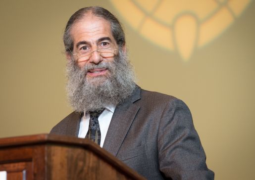 Dr. Bennett Vogelman speaks at the 2015 internal medicine residency graduation ceremony.