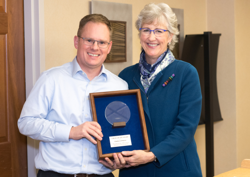 Dr. Toby Campbell receiving pallative care award