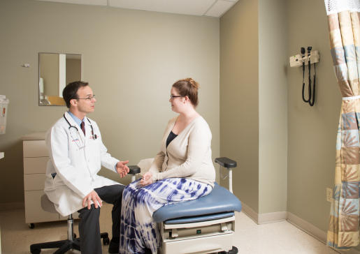 Dr. Micek with a patient in clinic.