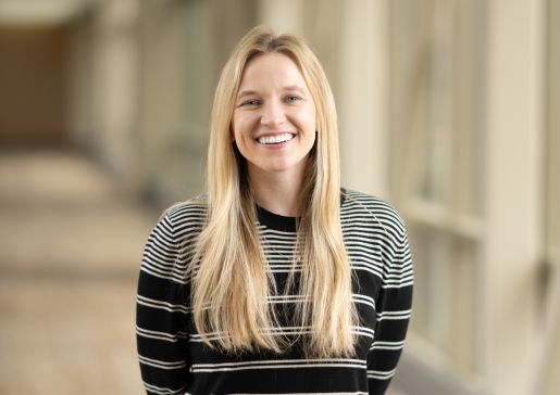 Photo of Dr. Caroline Burkey wearing a striped sweater