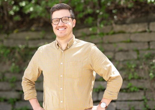 Photo of Dr. Michael Houghan wearing a brownish-yellow button down shirt.