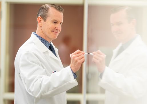 Dr. Mark Benson at the whiteboard